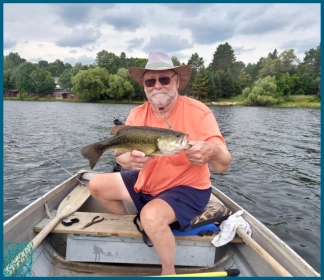 fishing in row boat on lake